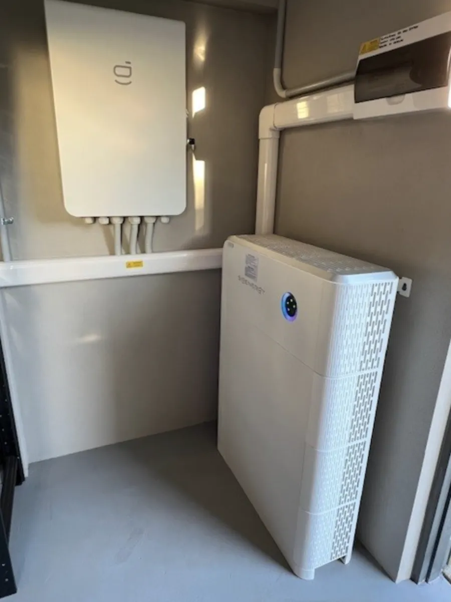 Sigenergy battery neatly installed in a home cupboard