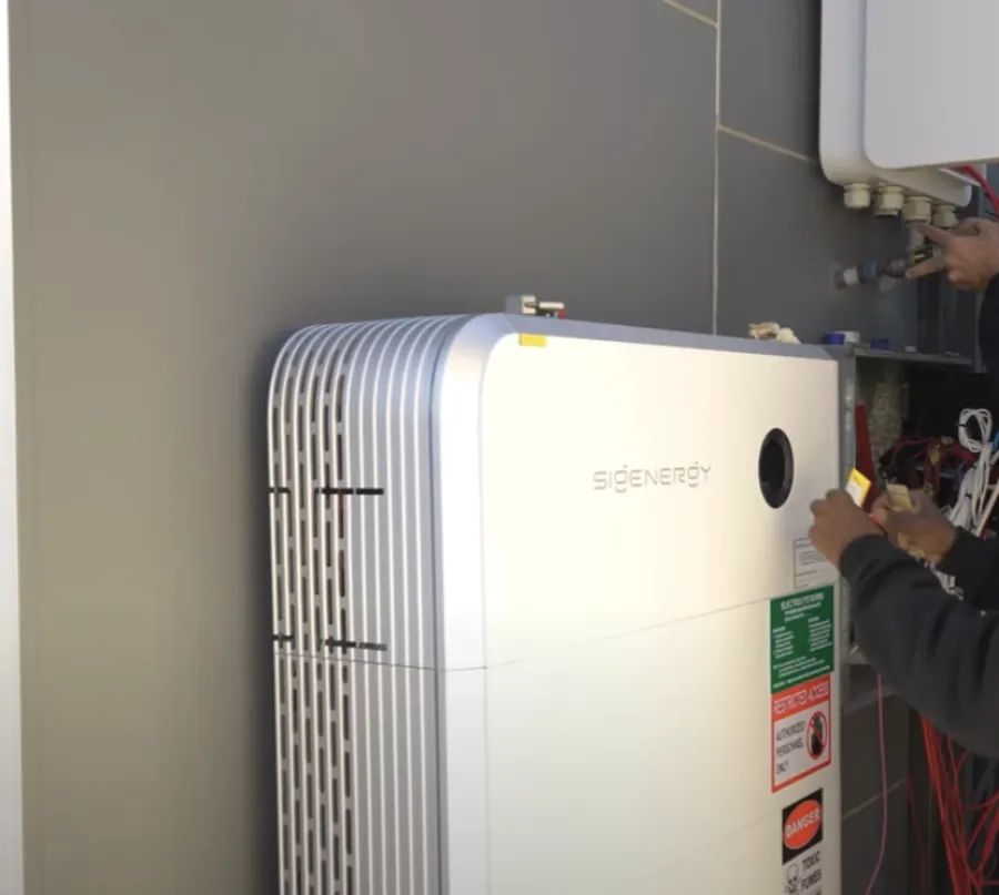 E³ Energy technician installing a Sigenergy battery in Melbourne