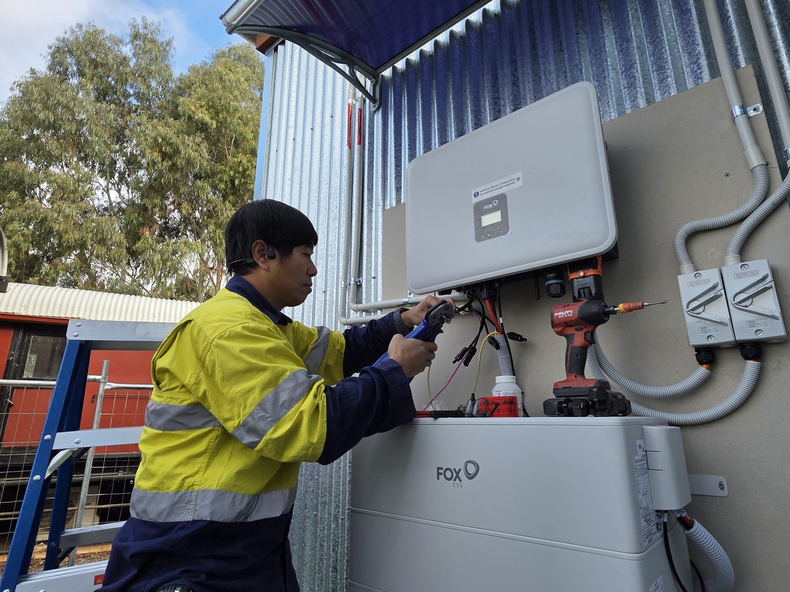 E3 Energy electrician wiring the FOX ESS inverter at the Mansfield Heritage Museum