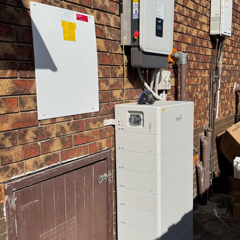 Fox ESS stacked home battery and inverter installed on a brick wall by E3 Energy in Melbourne
