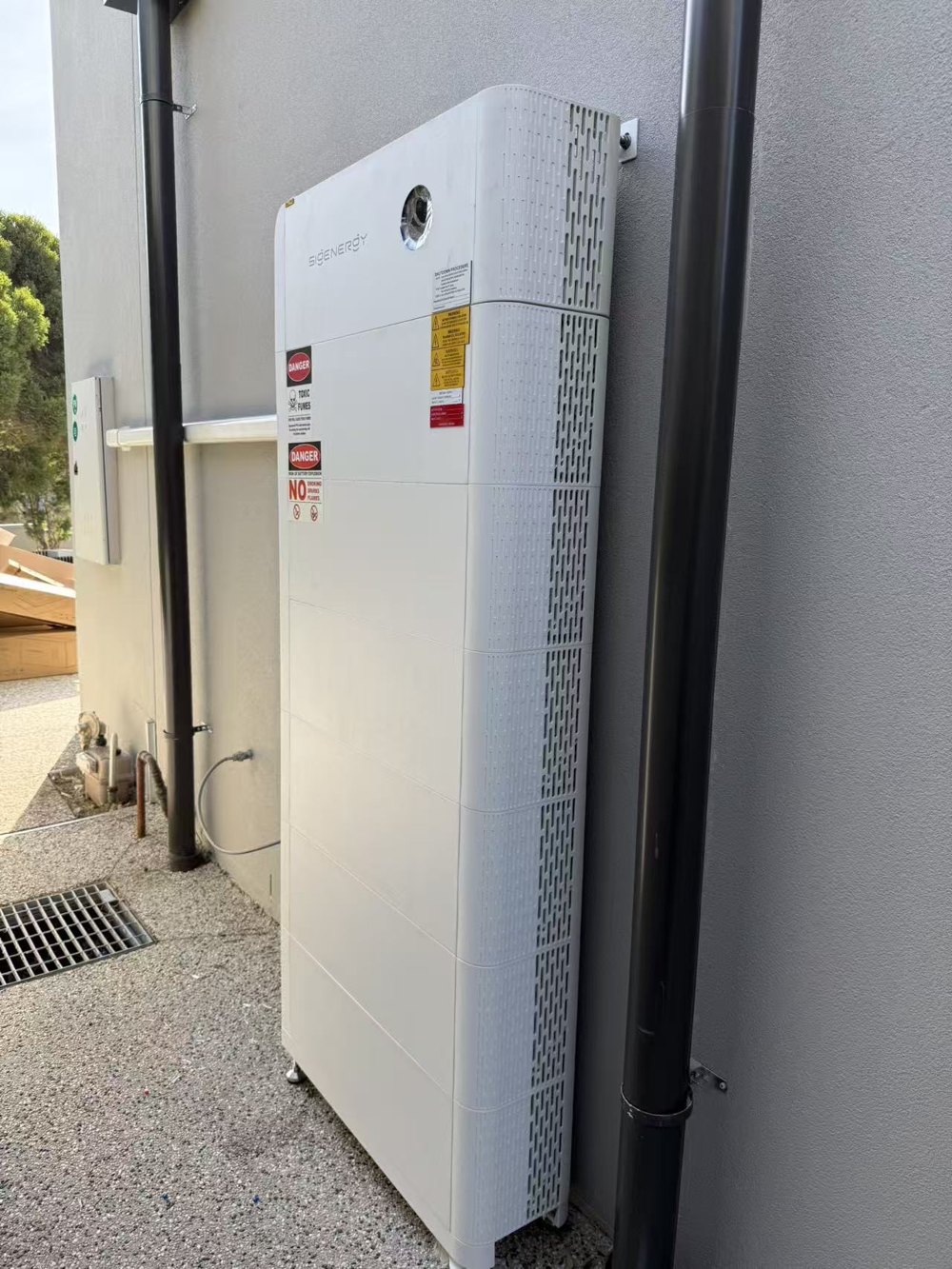 Sigenergy SigenStor battery stack installed by E3 Energy against an exterior wall at a Melbourne home